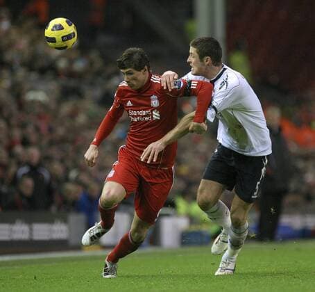 Premier League, FC Liverpool vs. Bolton Wanderers: Fernando Torres of Liverpool FC (red) battles with Gary Cahill of Bolton at Anfield 
