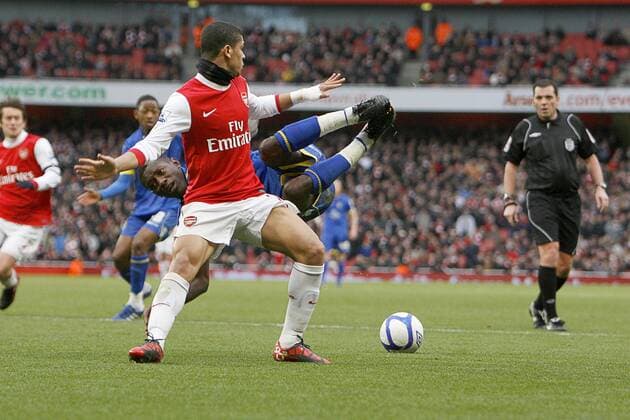 Football, Arsenal FC London vs. Leeds United, Arsenal s Denilson fouls Max Gradel of Leeds in the area giving leeds a penalty at The Emirates Stadium, London 