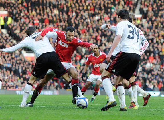 Liverpool try to stop Ryan Giggs (2.L) of Manchester United - FA Cup 3rd Round - Manchester United (ManU) vs. Liverpool FC 1:0 - EDITORIAL USE ONLY. No use with unauthorised audio, video, data, fixture lists, club league logos or live services. Online in-match use limited to 120 images, no video emulation. No use in betting, games or single club league player publications.