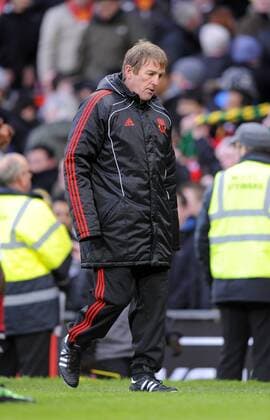 Kenny Dalglish Coach of Liverpool walks off dejected at the end - FA Cup 3rd Round - Manchester United (ManU) vs. Liverpool FC 1:0 - EDITORIAL USE ONLY. No use with unauthorised audio, video, data, fixture lists, club league logos or live services. Online in-match use limited to 120 images, no video emulation. No use in betting, games or single club league player publications.