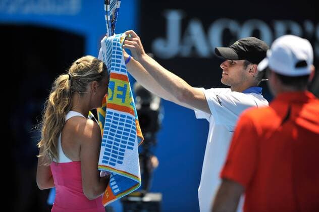 Jan. 16, 2011 - Melbourne, Victoria, Australia - Andy Roddick USA and Victoria Azarenka BLR play up for the crowd at the Rally For Relief charity exhibition match by top players of the 2011 Australian Open at Melbourne Park. - ZUMAx35