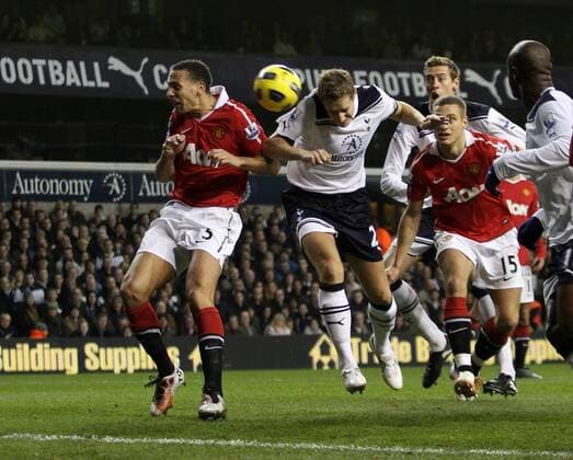 Tottenhams Michael Dawson sees his header go wide - Barclays Premier League, Tottenham Hotspur (white) v Manchester United Manu (red) 16th January, 2011 EDITORIAL USE ONLY. No use with unauthorised audio, video, data, fixture lists, club league logos or live services. Online in-match use limited to 120 images, no video emulation. No use in betting, games or single club league player publications.