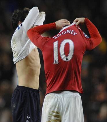 Football - Premier league - Tottenham Hotspur (white) v Manchester United (red) 16 01 2011 Wayne Rooney (ManU) exchanges shirts with Gareth Bale at the final whistle. 