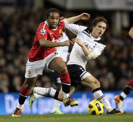Tottenhams Luka Modric tussles with Manchester Uniteds Anderson - Barclays Premier League, Tottenham Hotspur (white) v Manchester United Manu (red) 16th January, 2011 EDITORIAL USE ONLY. No use with unauthorised audio, video, data, fixture lists, club league logos or live services. Online in-match use limited to 120 images, no video emulation. No use in betting, games or single club league player publications.