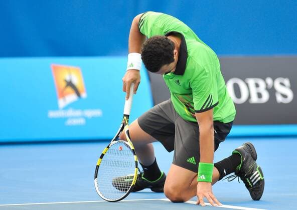 Melbourne - Jo-Wilfried Tsonga of France reacts during the first round men s single match at the Australian Open tennis tournament in Melbourne, 