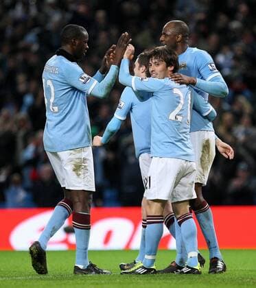 Football - FA Cup Third Round Replay - Manchester City vs. Leicester City Patrick Vieira of Manchester City (R) celebrates his goal with team mates at the City of Manchester Stadium 