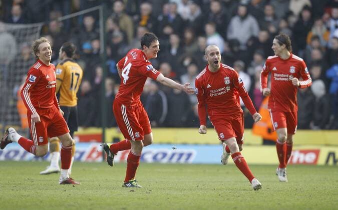 Raoul Meireles of Liverpool (2R) celebrates scoring the second goal of the game - Premier League - Wolverhampton Wanderers vs. Liverpool FC - EDITORIAL USE ONLY. No use with unauthorised audio, video, data, fixture lists, club league logos or live services. Online in-match use limited to 120 images, no video emulation. No use in betting, games or single club league player publications.