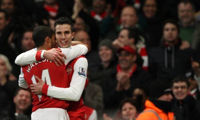 Arsenals Robin Van Persie (R) celebrates scoring his third goal Barclays Premier League Arsenal FC London - Wigan Athletic - EDITORIAL USE ONLY. No use with unauthorised audio, video, data, fixture lists, club league logos or live services. Online in-match use limited to 120 images, no video emulation. No use in betting, games or single club league player publications.