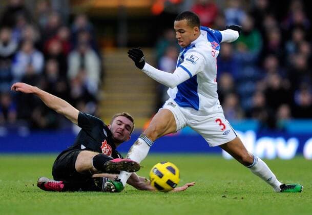 James Morrison of West Bromwich Albion (black) tackles Martin Olsson of Blackburn Rovers (blue) Barclays Premier League Blackburn Rovers v West Bromwich Albion 23rd January, 2011 EDITORIAL USE ONLY. No use with unauthorised audio, video, data, fixture lists, club league logos or live services. Online in-match use limited to 120 images, no video emulation. No use in betting, games or single club league player publications.