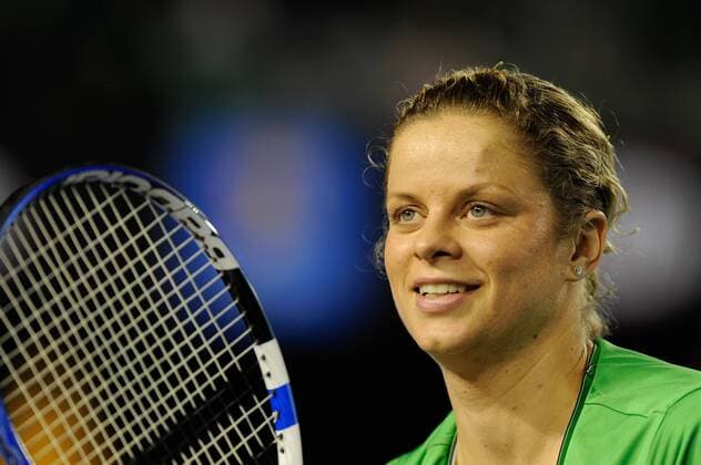 Melbourne, Victoria, Australia - Kim Clijsters (BEL) celebrates her win and tosses her wrist band to fans in her fourth round match on day eight of the 2011 Australian Open at Melbourne Park, Australia. - ZUMAx35