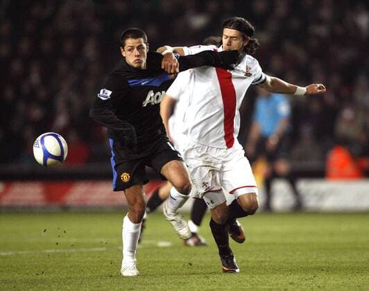 Javier Chicharito Hernandez of Manchester United (ManU black) holds off Jose Fonte of FC Southampton EON FA Cup 4th Round FC Southampton (white) vs Manchester United (ManU black) 29th January, 2011 EDITORIAL USE ONLY. No use with unauthorised audio, video, data, fixture lists, club league logos or live services. Online in-match use limited to 120 images, no video emulation. No use in betting, games or single club league player publications.