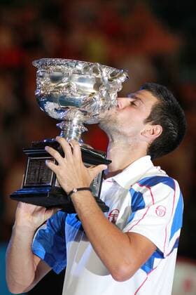 Novak Djokovic, SRB, kissing the trophy after the 2011 Australian Open men s singles final in Melbourne, 30 01 2011 -