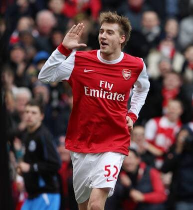 Arsenals Nicklas Bendtner celebrates scoring his sides opening goal by mocking the Huddersfield crowd - FA Cup - Arsenal FC London - Huddersfield Town - EDITORIAL USE ONLY. No use with unauthorised audio, video, data, fixture lists, club league logos or live services. Online in-match use limited to 120 images, no video emulation. No use in betting, games or single club league player publications.