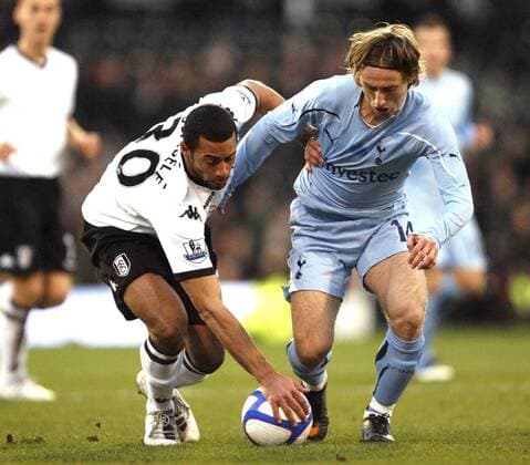 Moussa Dembele of Fulham and Luka Modric of Tottenham Hotspur fight for the ball EON FA Cup 4th Round Fulham FC (White) v Tottenham Hotspur (blue) 30th January, 2011 EDITORIAL USE ONLY. No use with unauthorised audio, video, data, fixture lists, club league logos or live services. Online in-match use limited to 120 images, no video emulation. No use in betting, games or single club league player publications.