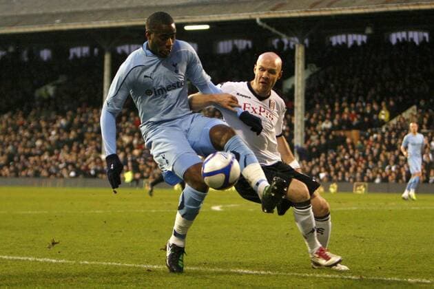 Football - Football - FA Cup Fourth Round - Fulham FC (white) vs. Tottenham Hotspur (blue) --- Fulham s Andy Johnson and Tottenham Hotspur s Sebastien Bassong in action at Craven Cottage 