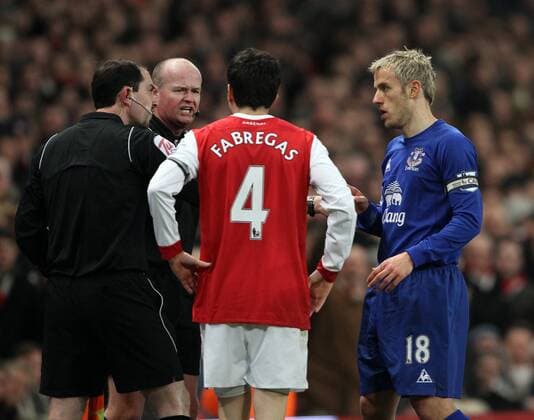 Arsenal FC (red) s Cesc Fabregas argues with referee (2.L) Lee Mason and assistant Stephen Child after Everton FCs goal Barclays Premier League Arsenal FC (red) v Everton FC 1st February, 2011 EDITORIAL USE ONLY. No use with unauthorised audio, video, data, fixture lists, club league logos or live services. Online in-match use limited to 120 images, no video emulation. No use in betting, games or single club league player publications.