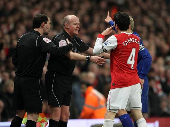Arsenal FC (red)s Cesc Fabregas argues with referee Lee Mason (2.L) and assistant Stephen Child after Everton FCs goal Barclays Premier League Arsenal FC (red) v Everton FC 1st February, 2011 EDITORIAL USE ONLY. No use with unauthorised audio, video, data, fixture lists, club league logos or live services. Online in-match use limited to 120 images, no video emulation. No use in betting, games or single club league player publications.