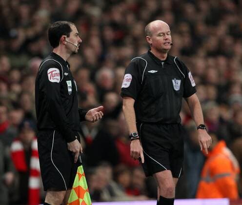Referee Lee Mason (R) consults with lineman Stephen Child after Everton FCs first goal Barclays Premier League Arsenal FC (red) v Everton FC 1st February, 2011 EDITORIAL USE ONLY. No use with unauthorised audio, video, data, fixture lists, club league logos or live services. Online in-match use limited to 120 images, no video emulation. No use in betting, games or single club league player publications.