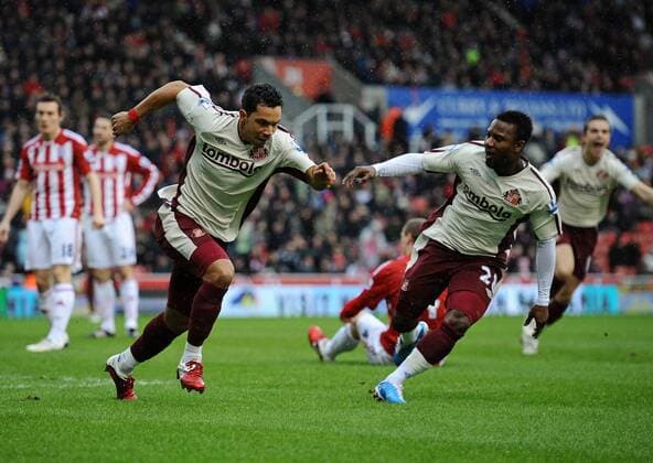 Stoke City vs. AFC Sunderland --- Kieran Richardson (L) and teammate Stephane Sessegnon of Sunderland celebrates scoring their opening goal  o0 Freude