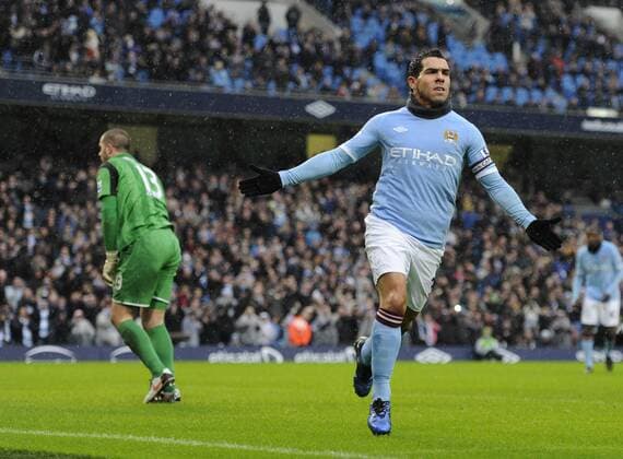 Carlos Tevez of Manchester City (R) celebrates his first goal --- Manchester City vs. West Bromwich Albion EDITORIAL USE ONLY. No use with unauthorised audio, video, data, fixture lists, club league logos or live services. Online in-match use limited to 120 images, no video emulation. No use in betting, games or single club league player publications. o0 Freude