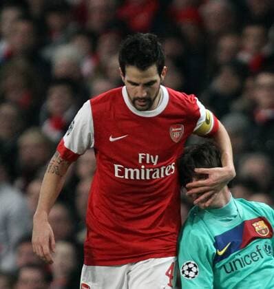 Arsenal London (red) v FC Barcelona (green) - Champions League First Knockout round . . 16.02.11 Cesc Fabregas (Arsenal) Lionel Messi (Barca) 