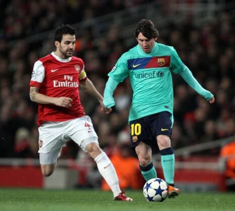 Arsenal London (red) v FC Barcelona (green) - Champions League First Knockout round . . 16.02.11 Cesc Fabregas (Arsenal) Lionel Messi (Barca) 