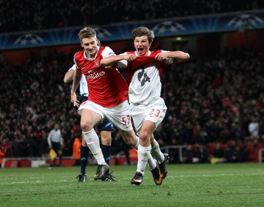 Arsenals Andrei Arshavin (R) celebrates scoring his sides second goal with Nicklas Bendtner --- UEFA Champions League 1st Leg last 16 Arsenal London (red) v FC Barcelona Barca (green) 16th February, 2011 EDITORIAL USE ONLY. No use with unauthorised audio, video, data, fixture lists, club league logos or live services. Online in-match use limited to 120 images, no video emulation. No use in betting, games or single club league player publications.