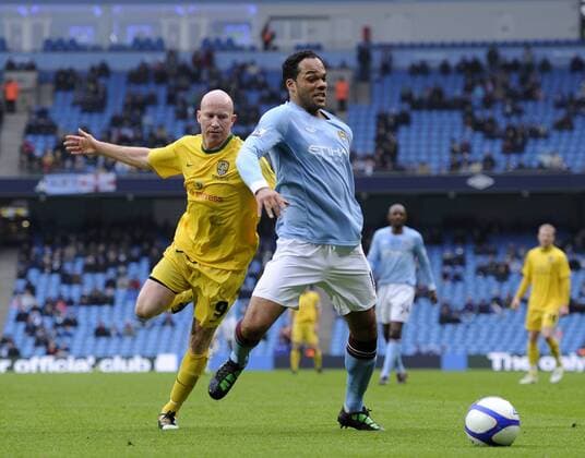 Joleen Lescott of Manchester City (R) and Lee Hughes of Notts County EON FA Cup 4th Round replay Manchester City v Notts County 20th February, 2011 EDITORIAL USE ONLY. No use with unauthorised audio, video, data, fixture lists, club league logos or live services. Online in-match use limited to 120 images, no video emulation. No use in betting, games or single club league player publications.