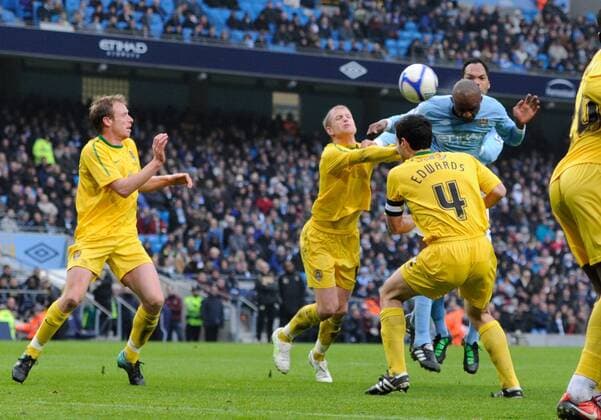 Patrick Vieira of Manchester City (R) heads the second goal EON FA Cup 4th Round replay Manchester City v Notts County 20th February, 2011 EDITORIAL USE ONLY. No use with unauthorised audio, video, data, fixture lists, club league logos or live services. Online in-match use limited to 120 images, no video emulation. No use in betting, games or single club league player publications.