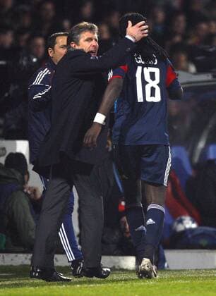 Bafetimbi Gomis of Lyon celebrates scoring his side s first goal with Lyon Coach Claude Puel, Olympique Lyon (blue) - Real CF Madrid (white) EDITORIAL USE ONLY. No use with unauthorised audio, video, data, fixture lists, club league logos or live services. Online in-match use limited to 120 images, no video emulation. No use in betting, games or single club league player publications. o0 Jubel, Freude