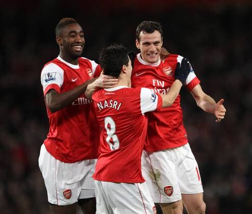 Arsenals Sebastien Squillaci (R) celebrates scorng his sides opening goal - Premier League - Arsenal FC London - Stoke City - EDITORIAL USE ONLY. No use with unauthorised audio, video, data, fixture lists, club league logos or live services. Online in-match use limited to 120 images, no video emulation. No use in betting, games or single club league player publications.