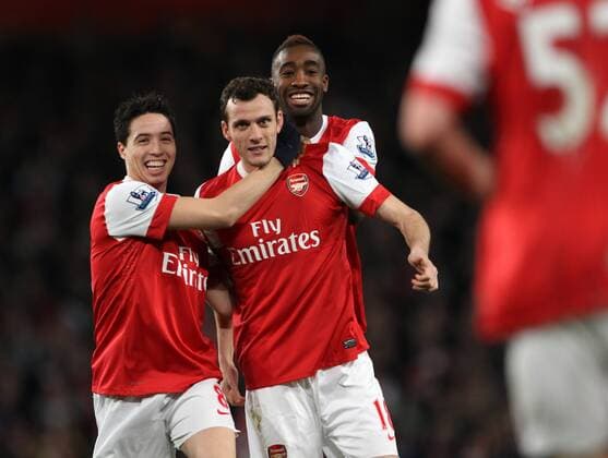 Arsenals Sebastien Squillaci (2L) celebrates scorng his sides opening goal - Premier League - Arsenal FC London - Stoke City - EDITORIAL USE ONLY. No use with unauthorised audio, video, data, fixture lists, club league logos or live services. Online in-match use limited to 120 images, no video emulation. No use in betting, games or single club league player publications.