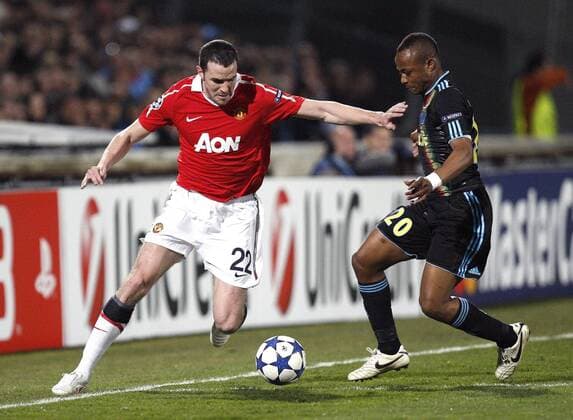 John O Shea (L) and Andre Ayew --- Champions League Round of 16 First Leg - Olympique Marseille (blue) vs. Manchester United ManU (red) --- EDITORIAL USE ONLY. No use with unauthorised audio, video, data, fixture lists, club league logos or live services. Online in-match use limited to 120 images, no video emulation. No use in betting, games or single club league player publications.