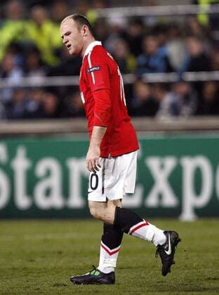 Wayne Rooney of Manchester United shows his disappointment at a decision --- Champions League Round of 16 First Leg - Olympique Marseille (blue) vs. Manchester United ManU (red) --- EDITORIAL USE ONLY. No use with unauthorised audio, video, data, fixture lists, club league logos or live services. Online in-match use limited to 120 images, no video emulation. No use in betting, games or single club league player publications.