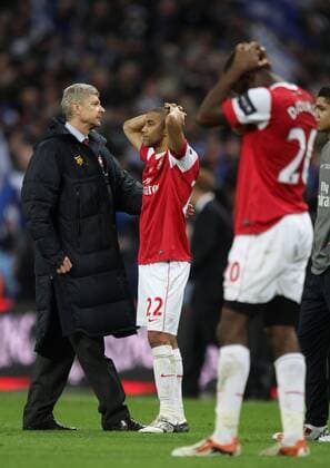 Carling Cup Final - Arsenal London (red) v Birmingham City (blue), 27.02.11 Arsenal s coach Arsene Wenger, Gael Clichy dejection. NOxONLINExUSExWITHOUTxENDxUSERxLICENCExFROMxFOOTBALLxDATACOxLTD  o0 Finale
