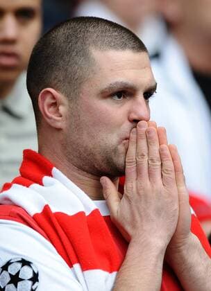 Football - League Cup Final - An Arsenal fan looks nervous at Wembley Stadium, London 