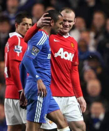 Manchester United s Wayne Rooney (R) smiles at Chelsea s Ashley Cole Barclays Premier League, Chelsea FC London vs Manchester United (ManU) 1st March, 2011 EDITORIAL USE ONLY. No use with unauthorised audio, video, data, fixture lists, club league logos or live services. Online in-match use limited to 120 images, no video emulation. No use in betting, games or single club league player publications.
