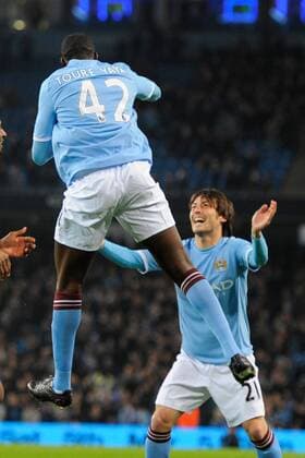Yaya Toure of Manchester City celebrates scoring the first goal with provider David Silva of Manchester City EON FA Cup 5th Round Manchester City (blue) v Aston Villa (black) 2nd March, 2011 EDITORIAL USE ONLY. No use with unauthorised audio, video, data, fixture lists, club league logos or live services. Online in-match use limited to 120 images, no video emulation. No use in betting, games or single club league player publications.