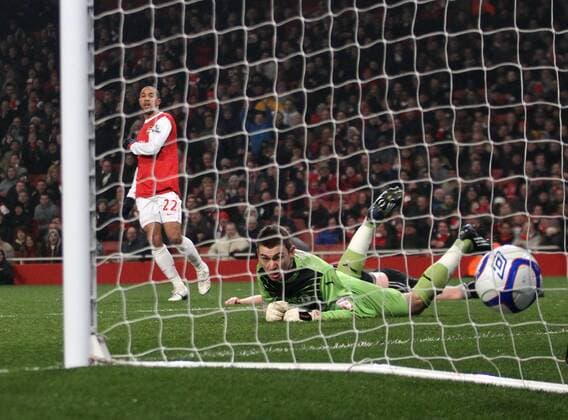 Arsenal FC s Gael Clichy scoring his sides fifth goal past Leyton Orients Jamie Jones - EON FA Cup 5th Round Replay Arsenal FC (red) v Leyton Orient (black) 2nd March, 2011 EDITORIAL USE ONLY. No use with unauthorised audio, video, data, fixture lists, club league logos or live services. Online in-match use limited to 120 images, no video emulation. No use in betting, games or single club league player publications.