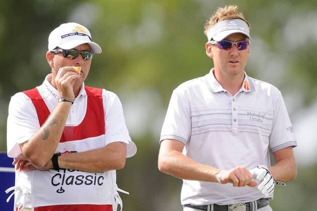 Mar. 3, 2011 - Palm Beach Gardens, FL - High winds were the story of the day as Ian Poulter (England, R) and his caddy enjoy a moment on the 17th hole at the PGA Honda Classic at PGA National Resort & Spa in Palm Beach Gardens, - ZUMAx71