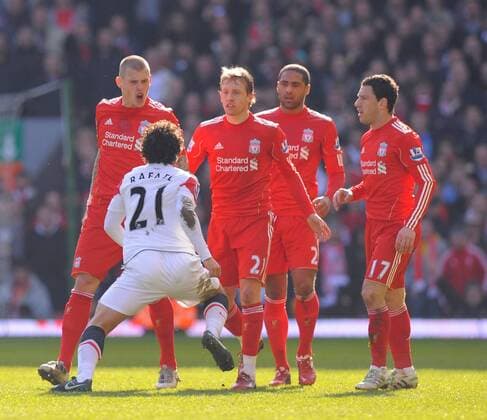 Liverpool players Martin Skrtel (L) and Lucas (3.L) of Liverpool confront Rafael Da Silva of Manchester United - Barclays Premier League - Liverpool FC vs. Manchester United (ManU) 6th March, 2011 EDITORIAL USE ONLY. No use with unauthorised audio, video, data, fixture lists, club league logos or live services. Online in-match use limited to 120 images, no video emulation. No use in betting, games or single club league player publications.