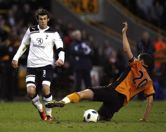 Gareth Bale (L) of Tottenham Hotspur is tackled by Nenad Milijas of Wolverhampton Wanderers Barclays Premier League Wolverhampton Wanderers v Tottenham Hotspur 6th March, 2011 EDITORIAL USE ONLY. No use with unauthorised audio, video, data, fixture lists, club league logos or live services. Online in-match use limited to 120 images, no video emulation. No use in betting, games or single club league player publications.