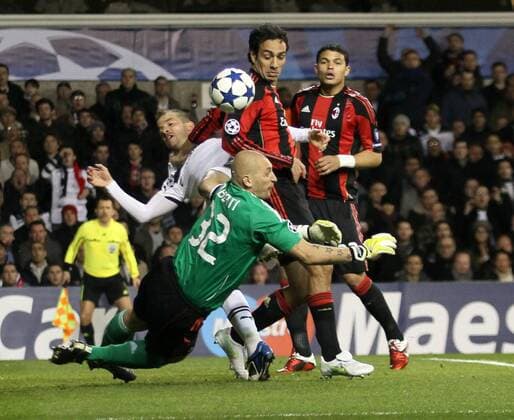 Tottenhams Rafael Van Der Vaart (white) tussles with Milans goalkeeper Christian Abbiati UEFA Champions League 2nd Leg last 16 Tottenham Hotspur (white) v AC Milan (red) 9th March, 2011 EDITORIAL USE ONLY. No use with unauthorised audio, video, data, fixture lists, club league logos or live services. Online in-match use limited to 120 images, no video emulation. No use in betting, games or single club league player publications.