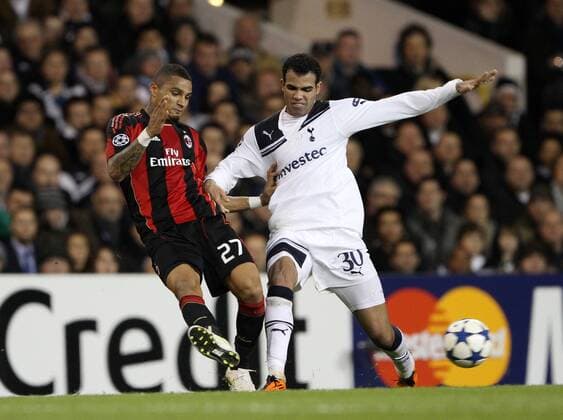 Tottenhams Sandro tussles with Milans Kevin-Prince Boateng UEFA Champions League 2nd Leg last 16 Tottenham Hotspur (white) v AC Milan (red) 9th March, 2011 EDITORIAL USE ONLY. No use with unauthorised audio, video, data, fixture lists, club league logos or live services. Online in-match use limited to 120 images, no video emulation. No use in betting, games or single club league player publications.