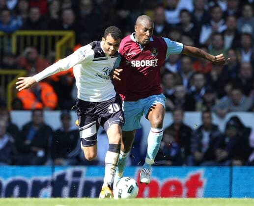 Tottenhams Sandro tussles with West Hams Carlton Cole --- Tottenham Hotspur (white) vs. West Ham United (red) EDITORIAL USE ONLY. No use with unauthorised audio, video, data, fixture lists, club league logos or live services. Online in-match use limited to 120 images, no video emulation. No use in betting, games or single club league player publications.