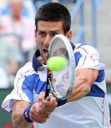 Novak Djokovic of Serbia hits a shot during his mens final match at the BNP Paribas Open in Indian Wells, California on March 20, 2011.  IDW20110320723