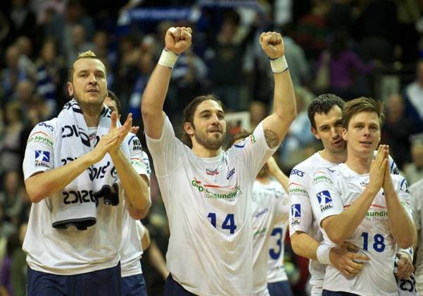 Handball Bundesliga HBL 20.03.2011 Berlin Max Schmeling Halle Füchse Berlin (gelb) geg HSV Hamburg (weiss) vlnr Pascal HENS 23 HSV, Bertrand GILLE 14 HSV, Marcin LIJEWSKI 22 HSV, Hans LINDBERG 18 HSV
