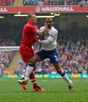 Wales Craig Bellamy (L) tussles with Englands Ashley Cole European Championship Qualifying Group G Wales v England - EDITORIAL USE ONLY. No use with unauthorised audio, video, data, fixture lists, club league logos or live services. Online in-match use limited to 120 images, no video emulation. No use in betting, games or single club league player publications.