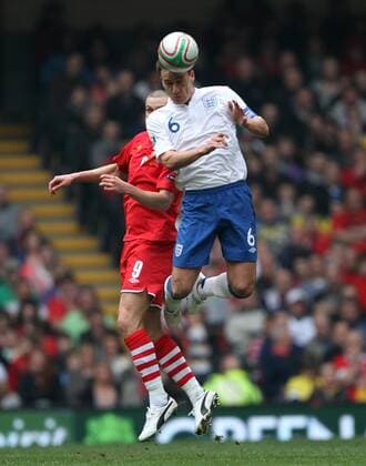 Wales Steve Morison (L) tussles with Englands John Terry European Championship Qualifying Group G Wales v England - EDITORIAL USE ONLY. No use with unauthorised audio, video, data, fixture lists, club league logos or live services. Online in-match use limited to 120 images, no video emulation. No use in betting, games or single club league player publications.