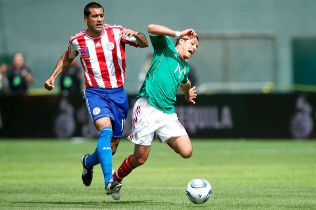 Mar. 26, 2011 - Oakland, California, U.S - Paraguay defender Paulo Cesar Da Silva (14) trips up Mexico forward Javier Hernandez (14) during the FIFA friendly match between Mexico and Paraguay at Oakland-Alameda County Coliseum in Oakland, CA. Mexico beat Paraguay 3-1. - ZUMAq48 o0 Chicharito
